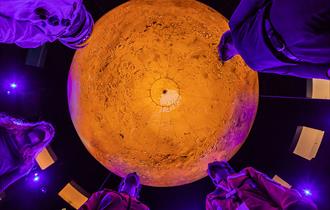 People stand under Mars