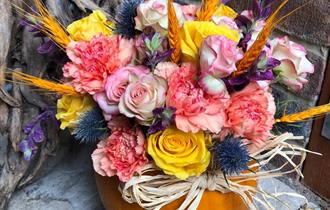 Flower arrangement in a pumpkin