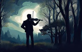 A man playing violin in a darkened woodland