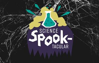 A black background with cobwebs. A graphic saying 'Science Spooktacular'.