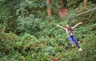 Women on zipline at Leeds Castle, Kent