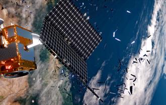 Satellite surrounded by space junk floating in space.