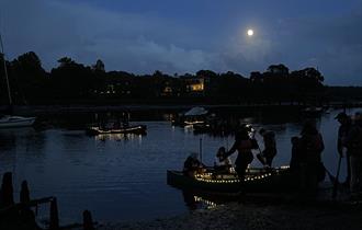 Canoe on the water under the moonlight