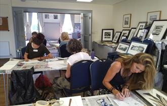 Students at work in Botolph Village Hall under the tuition of Artist, Kim Major-George