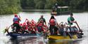 Team Activity Group - 2 canoes full of adults in the river.