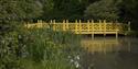 Picturesque bridge at Woolbeding Gardens in Midhurst Image credit Laurence Perry