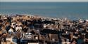 Aerial view of Hastings Old Town, Hastings Contemporary and fishing harbour beside the sea.
