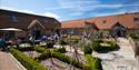 Outdoor cafe seating area and Gardens at South Downs Heritage Centre