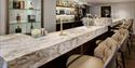 Bar/Lounge at The Reading Room, Reading with marble top and gorgeous leather bar chairs.