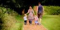 Family walking the grounds of Battle Abbey and Battlefield