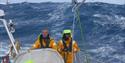 Big waves behind a Clipper boat - credit clipperroundtheworld.com