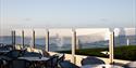 Exterior view of The Relais Cooden Beach. Shows terrace seating area with views towards the sea.