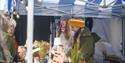 Stallholders showing off their unique wares at a Hotwalls Studios Festive Creative Market