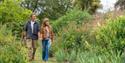Couple exploring Quex Gardens, part of Quex House and Gardens, Kent