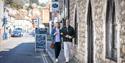 Couple walking along Hythe High Street in Kent