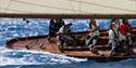 Crew sailing boat in competition