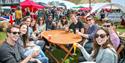 Foodies Festival - a group of people around the table