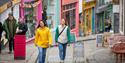 Friends exploring Folkestone High Street in Kent