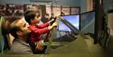 Maidenhead Heritage Centre: man and boy enjoying the Spitfire Simulator