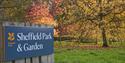 Sheffield Park National Trust sign with autumnal coloured trees behind