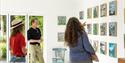 People viewing the art on the wall at Sadie Tierney's Studio in Ventnor at the 2025 Isle of Wight Open Studios, event, what's on - image credit: Julia