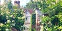 PASHLEY MANOR GARDENS rose walk to house by Kate Wilson