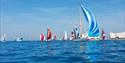 Yachts sailing around the Needles, Round the Island Race, Isle of Wight, Credit: Paul Wyeth