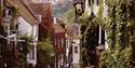 Mermaid Street in Rye town showing cobbles, pubs and timber-framed houses