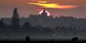 The ancient town of Rye taken from the Rye Harbour Nature Reserve at sunset