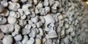 Skull wall in the ancient crypt at St Leonards Church in Hythe, Kent