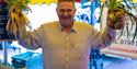 A stallholder at Southsea Food Festival holds up his fresh produce