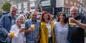 Merry festivalgoers enjoying a drink at the Southsea Food Festival