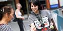 Staff member handing out voting tokens for the British Street Food Awards