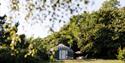 Outside view of a yurt within the grounds of The Garlic Farm, Newchurch, self-catering, glamping, luxury, country, Isle of Wight