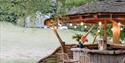 Seating area within the grounds of the yurts at The Garlic Farm, Newchurch, self-catering, glamping, luxury, country, Isle of Wight