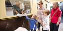 Visitors collecting ticket to travel on Bekonscot Model Railway