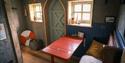 red table and bench with cushions