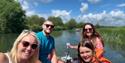 Family on a boat with blue skies - Cotswold Boat Hire