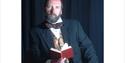 Gerald Dickens holding a book, Dickens House Party Weekend at The Royal Hotel, Ventnor, Isle of Wight, event, what's on