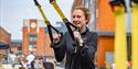 Person taking part in an activity at the Sweat Fitness Festival in Gunwharf Quays