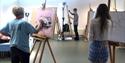 Group of people doing a painting workshop at Cornerstone Arts Centre in Oxfordshire - one of many different types of workshops offered