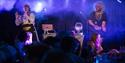Image courtesy of dfphotography. Image from the show 2024 Blingo, performers on stage with wigs and a disco ball.