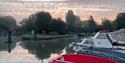 Boats in the river at sunset - Cotswold Boat Hire