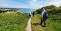 Group walking along coast at the Isle of Wight Walking Festival, what's on