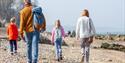 Family walking on the beach at the Isle of Wight Walking Festival, what's on