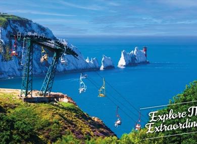 View of the Needles in the background with people on the chairlift, The Needles Landmark Attraction, Isle of Wight, Things to Do