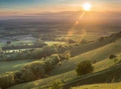 View from Ditchling Beacon Near Brighton and Hove in East Sussex at sunset.