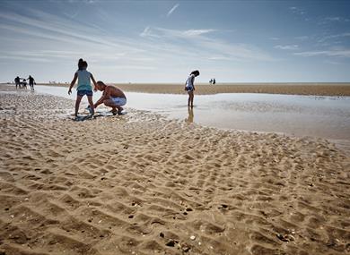 Children playing at low tide on Camber Sands