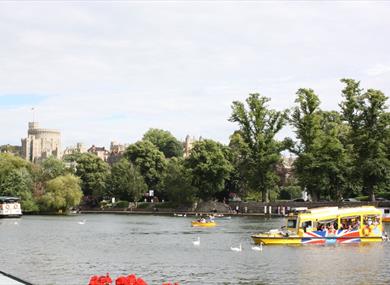 Windsor Duck Tours on River Thames with Windsor Castle in distance