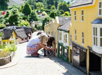 Child viewing the Old Shanklin Village miniature at the Model Village Godshill, Isle of Wight, Things to Do